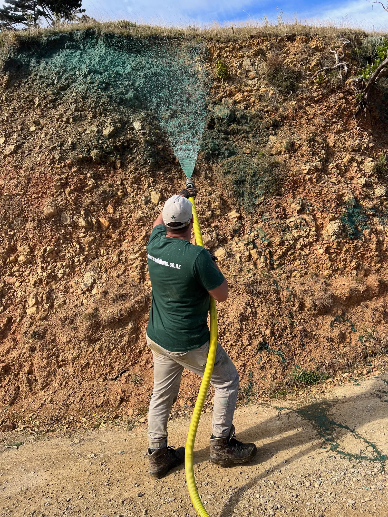 Hydroseeding process — slurry mix being applied